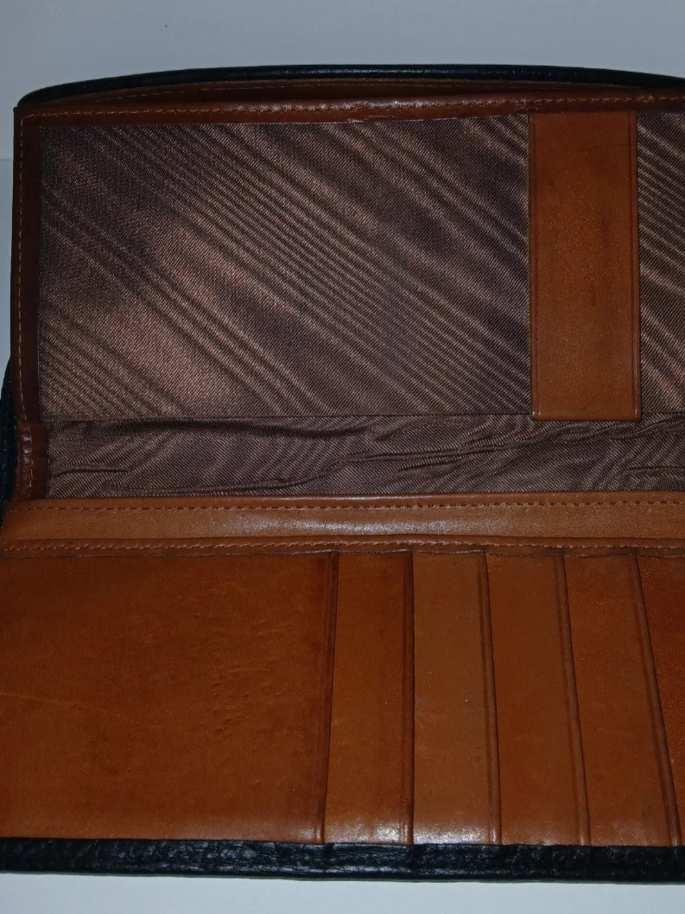 The Dooney & Bourke Black Brown Leather Kisslock Framed Credit Card Trifold